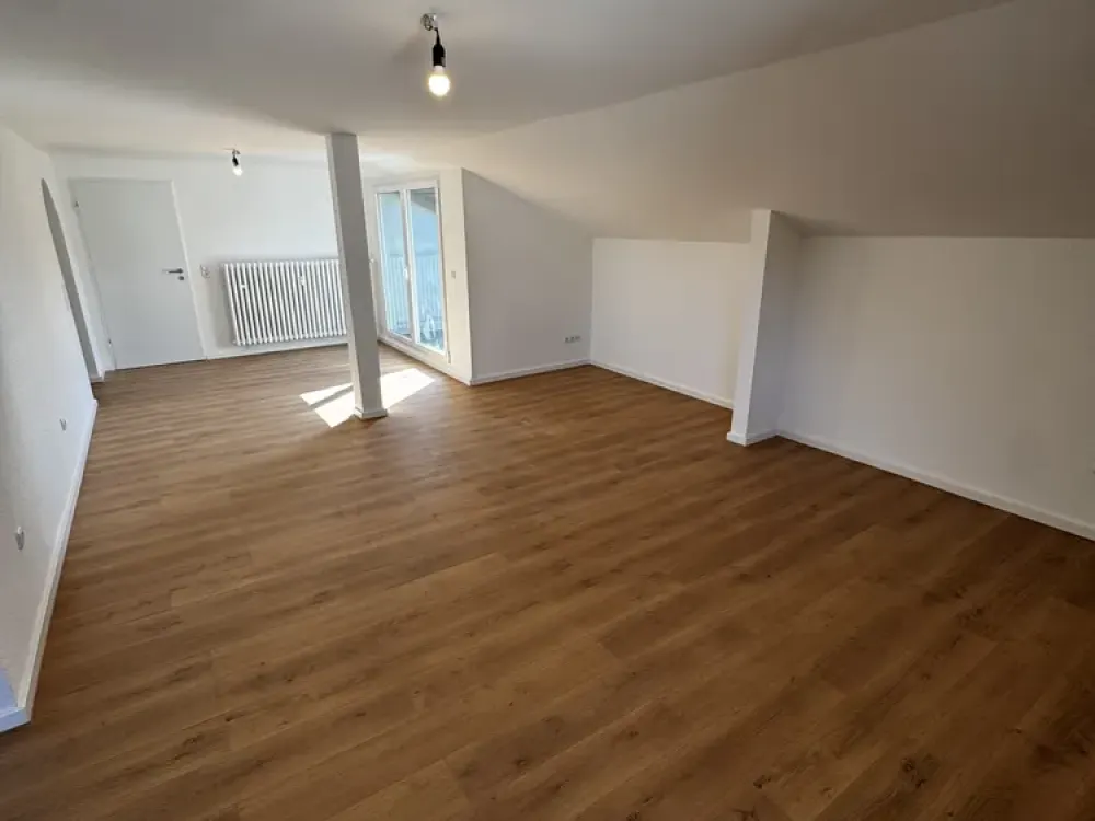 Charming, fully renovated 3-room attic apartment with loggia