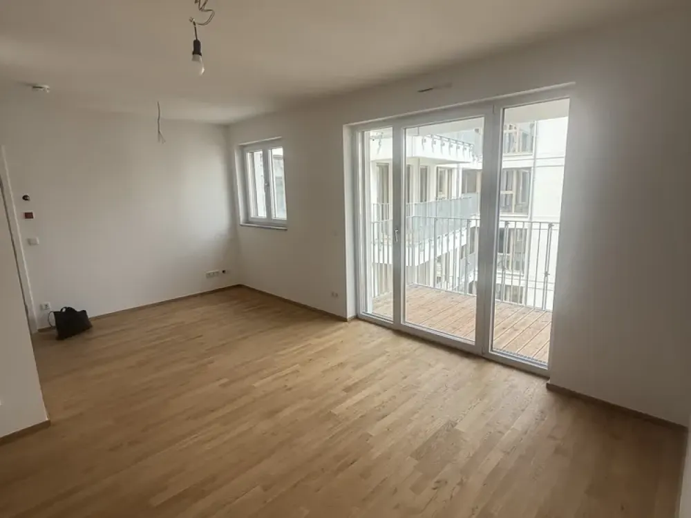 Stilvolle 2-Zimmer-Neubauwohnung mit hochwertiger Einbauküche, Balkon und Fußbodenheizung