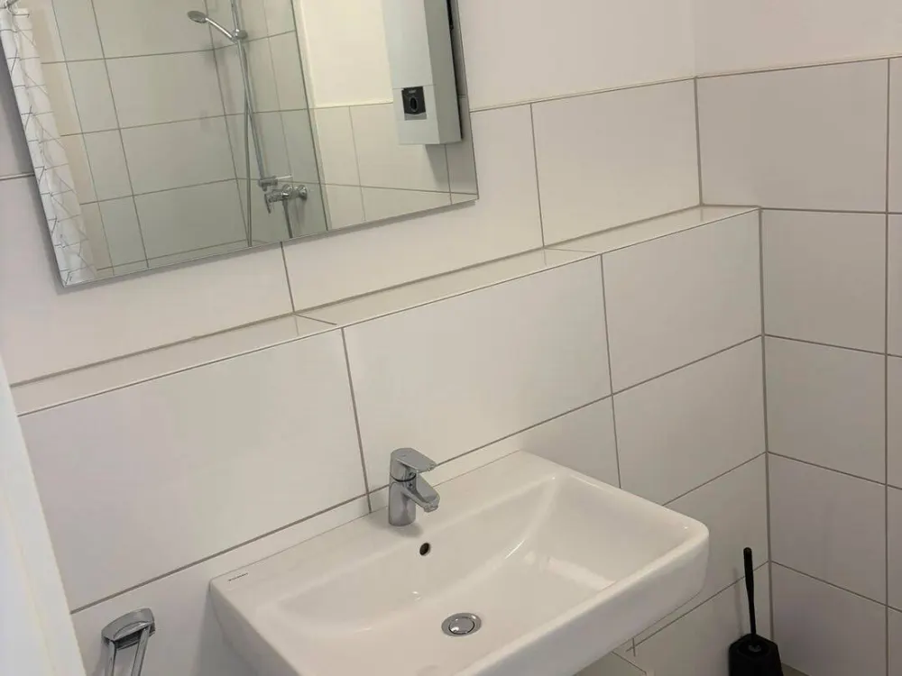 Moderne, möblierte 1-Zimmer-Wohnung mit Balkon & TG-Stellplatz