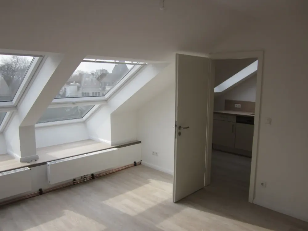 Top renovated 1-room attic apartment with separate fitted kitchen