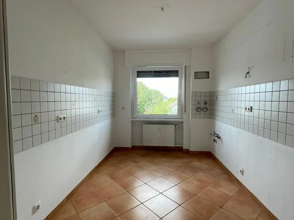Energetisch saniert, niedrige Heizkosten: helle 3-Zimmer-Wohnung mit Wintergarten und Garage