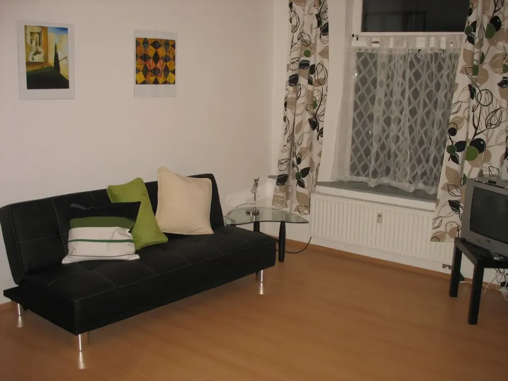 Partially furnished 2-room apartment approx. 60 m² on the ground floor with living room kitchen and outdoor seating