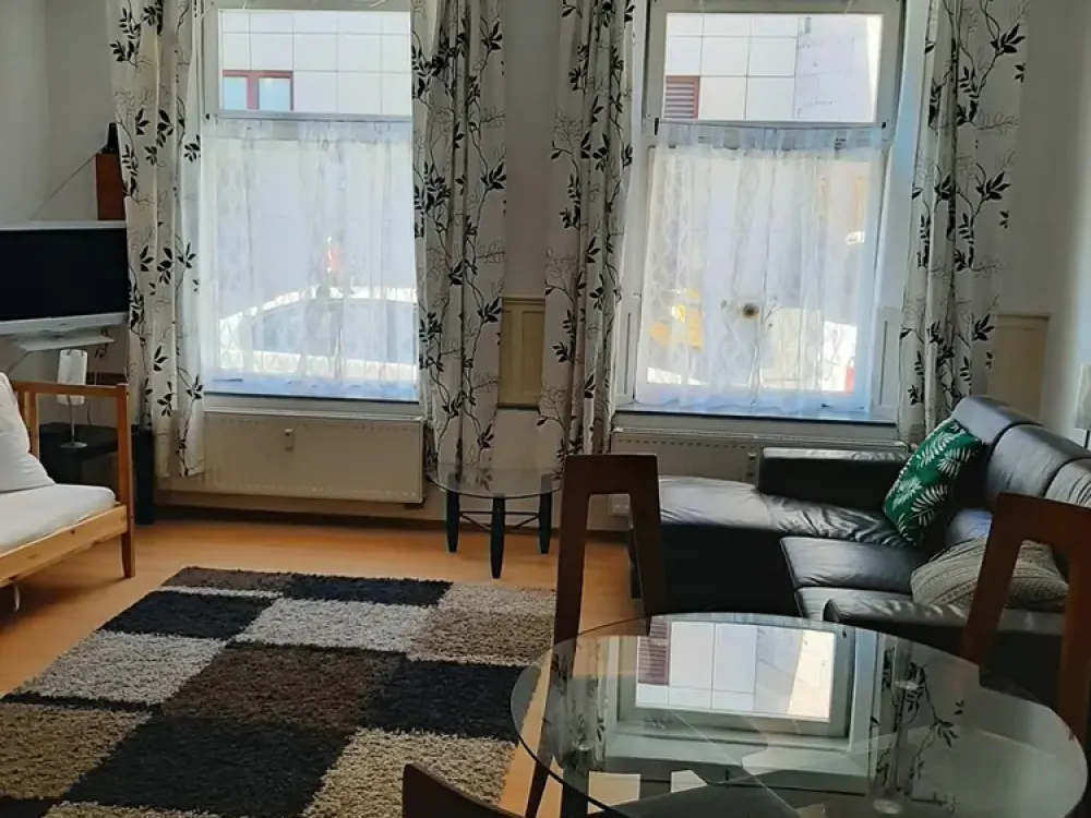 Partially furnished 2-room apartment approx. 60 m² on the ground floor with living room kitchen and outdoor seating