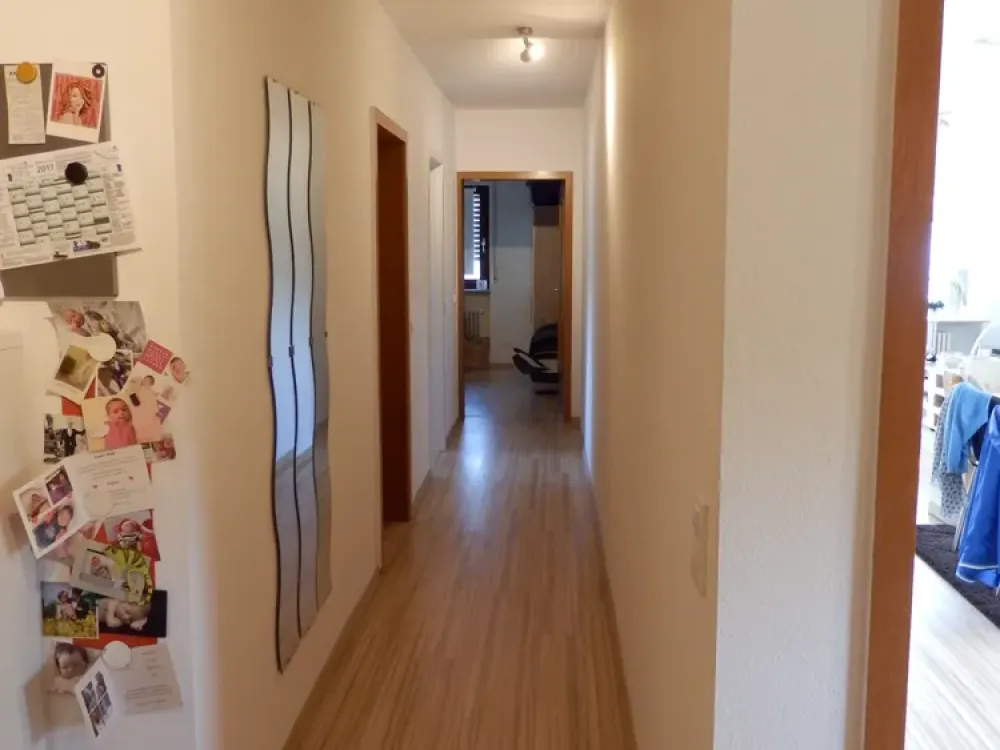 Modernized Top-Floor Apartment with Three and a Half Rooms, Balcony, and Fitted Kitchen in St. Ingbert