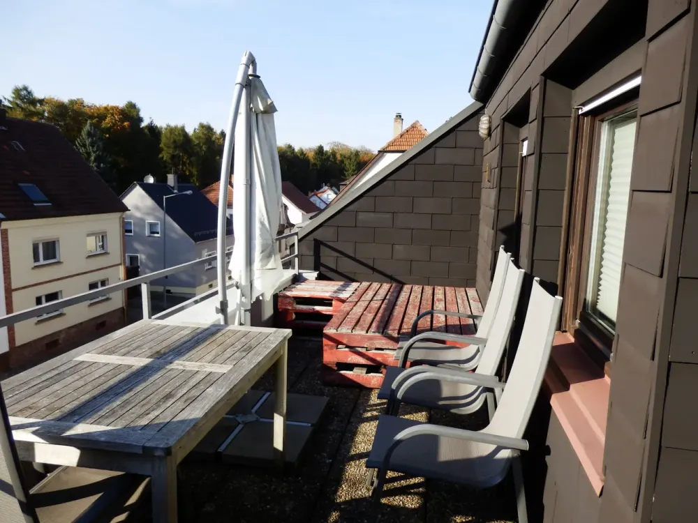 Modernized Top-Floor Apartment with Three and a Half Rooms, Balcony, and Fitted Kitchen in St. Ingbert