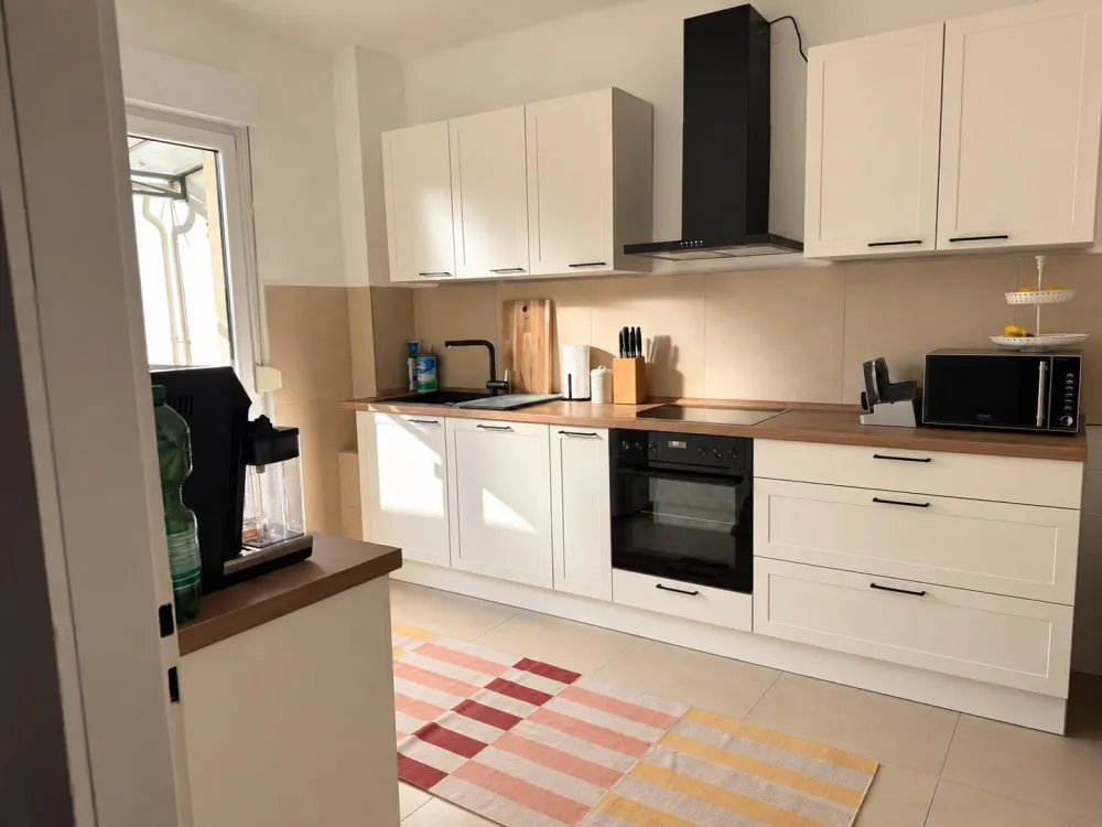 Charming 3-Room Apartment with Large Roof Terrace, Balcony & Garden