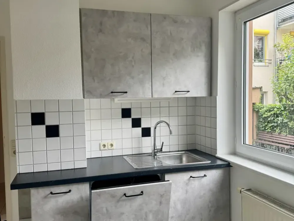 gepflegte 1-Zimmer-Erdgeschosswohnung mit kompletter EBK