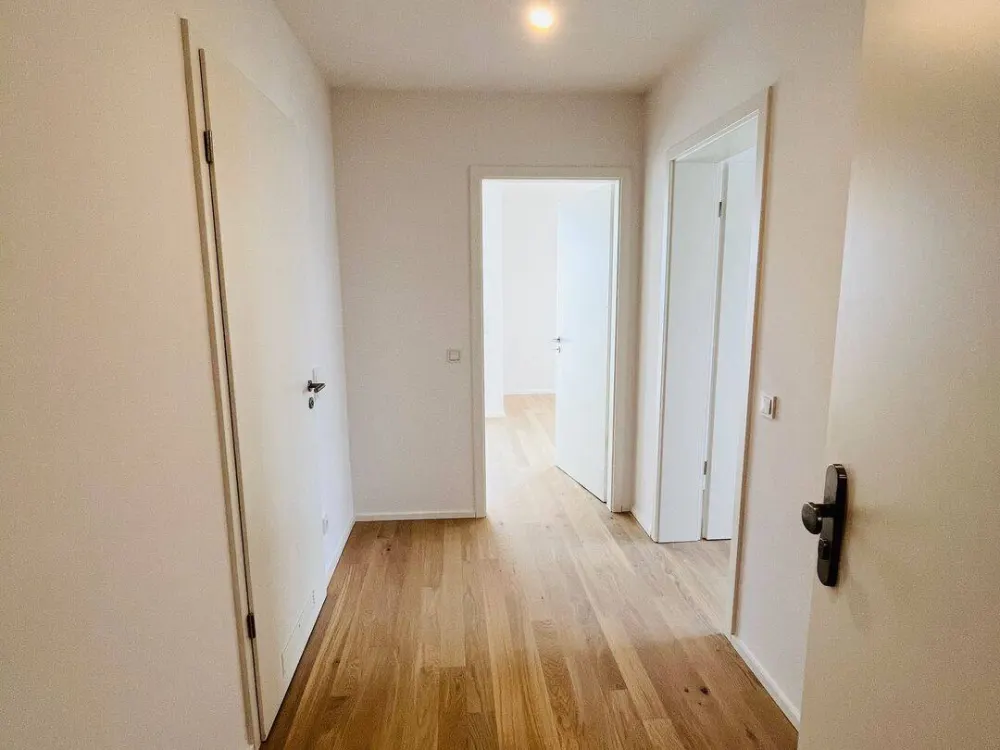 Neubau: Hochwertige 2-Zi.-Whg. mit Premium Küche, Südloggia & TG-Einzelstpl. in München-Feldmoching