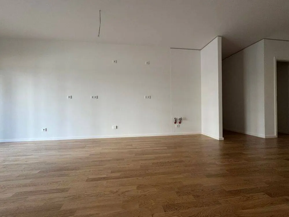 Erstbezug!: 4-Zimmer-Wohnung im Erdgeschoss mit Balkon