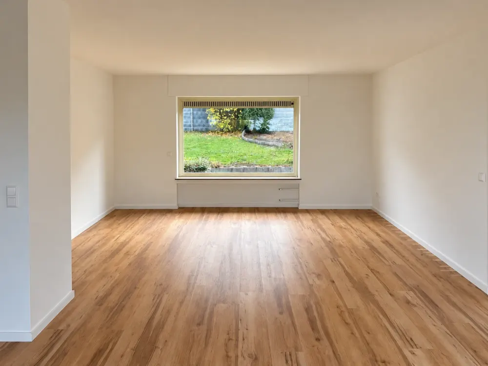 Modern 3.5-Room Ground Floor Apartment with Private South Garden, Rhine Plain View & Garage