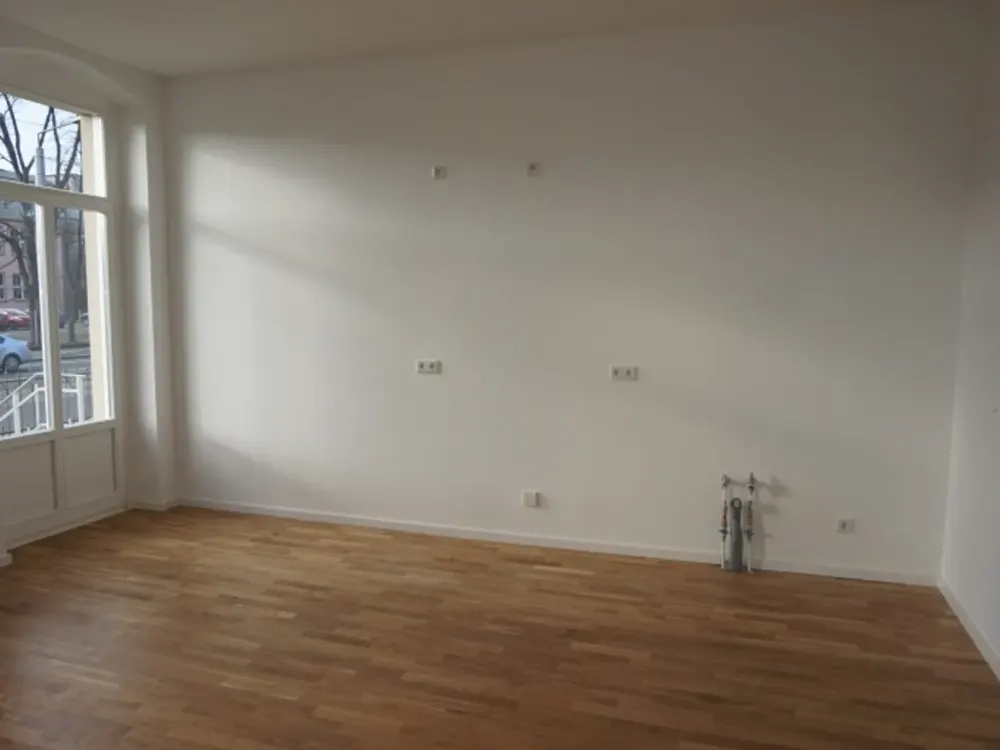 Helle Wohnung mit Gartenanteil, Parkettboden und offener Küche