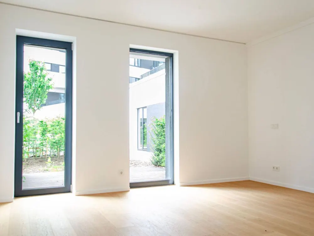 Helles Zweizimmerstudio mit Terrasse ins Grüne und Loggia mit Südausrichtung // Community-Spaces